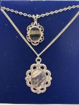 2 vintage blue john pendants on silver chains with spring ring clasps. A 1.6cm pendant on a 17"