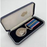 A boxed Royal British Legion National Service Medal No. 72716, unnamed. Complete with ribbon and