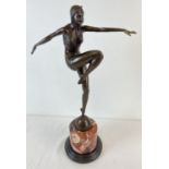 An Art Deco style bronze figurine of an exotic female dancer in Eastern attire. On a cylindrical