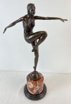 An Art Deco style bronze figurine of an exotic female dancer in Eastern attire. On a cylindrical