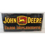 A rectangular shaped enamelled metal wall advertising sign for John Deere farm implements. Approx.