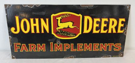 A rectangular shaped enamelled metal wall advertising sign for John Deere farm implements. Approx.