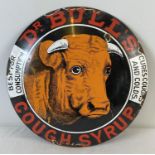 A small circular Dr Bull's Cough Syrup convex shaped enamelled metal wall advertising sign.