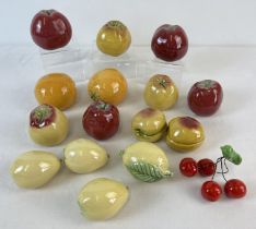 A small collection or Portuguese ceramic fruit by Bordallo Pinhiero. Comprising: red apples,