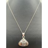 A modern design silver triangular pendant set with a boulder opal, on a 20" fine curb chain with