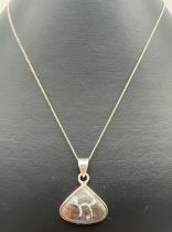 A modern design silver triangular pendant set with a boulder opal, on a 20" fine curb chain with