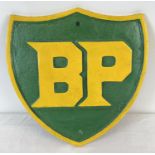A large shield shaped cast iron BP wall plaque, painted in Green & Yellow. Approx. 33cm tall x