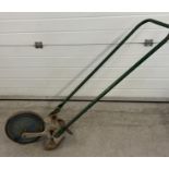 A vintage agricultural 'The Jalo Gardener' push hoe with wheel. Approx. 130cm long.