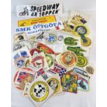 45 vintage cloth patches, stickers and a rosette for British, world and European Speedway teams.
