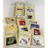 A box of over 200 assorted PHQ Royal Mail stamp postcards.