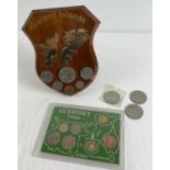 A cased Guernsey Coinage set together with a wooden plaque with Falklands Liberation coins and 3