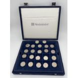 A collection of 14 collectors 50p coins together with a Westminster coin collectors case with 2 lift