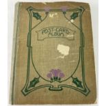 An Art Nouveau postcard album containing 160+ assorted British & overseas postcards and greetings