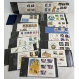 A blue album containing 50 assorted first day covers dating from the late 1970's through to early