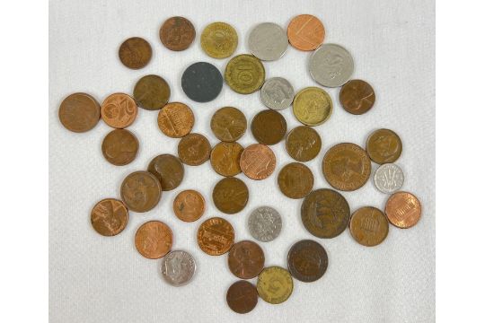 A small collection of foreign and British coins. To include examples from America, Australia,