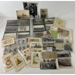 44 WWI and WWII military postcards to include RP's and embroidered sweetheart cards. Many cards