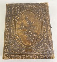 A large Victorian leather bound photograph album with assorted photographic portraits and cabinet