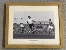 A framed and glazed signed reproduced black and white photograph of Tottenham Hotspur footballer