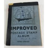 A vintage Stanley Gibbons Stamp album of assorted world stamps to include franked & unfranked