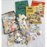 A collection of used loose British and world stamps together with 3 vintage stamp albums. Nelson