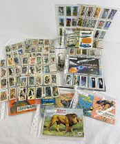 A folder of assorted vintage Brooke Bond tea cards and albums - full sets. To include Song Birds,