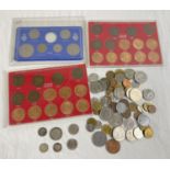 A collection of British and foreign vintage coins. To include Elizabeth II cased sets of