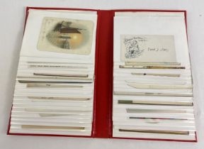 An album containing 40 assorted Edwardian & vintage greetings cards.