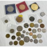 A collection of vintage British and foreign coins and medallions. To include an 1875 Victoria penny,