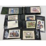 An album containing 100+ assorted stamped first day issue PHQ cards.