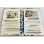 An album of floral design containing 40 assorted Edwardian & vintage greetings cards.