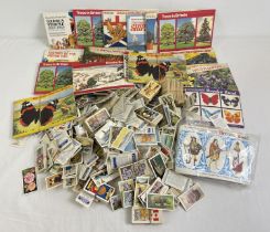 A collection of assorted vintage tea and cigarette cards to include 20 Brooke Bond albums (full,