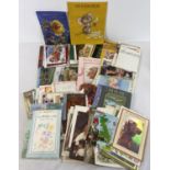 A box of assorted vintage & more modern postcards and greetings cards.