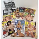 A collection of assorted adult erotic magazines and loose pages. Magazines have either covers or