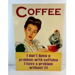 A large comical printed coffee tin sign. With holes for wall fixing. Approx. 70cm x 50cm.