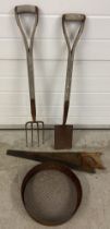 4 vintage garden tools. A wooden handled ladies spade and fork together with a saw and a sieve.