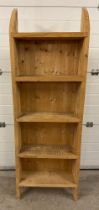 A modern rustic pine 4 shelf slimline set of shelves with curved top and shaped base. Approx.