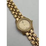 A ladies 810-L wristwatch by Fendi. Gold tone bracelet strap with Fendi logo to clasp. Gold tone