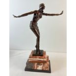 An Art Deco style bronze figurine of an exotic female dancer in Eastern attire. On a rectangular