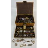 A vintage leather jewellery box with Egyptian decoration to top containing a mixed collection of