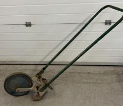 A vintage agricultural 'The Jalo Gardener' push hoe with wheel. Approx. 130cm long.