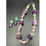 An amethyst, rock Crystal and freshwater pearl necklace with silver T Bar clasp. Together with a