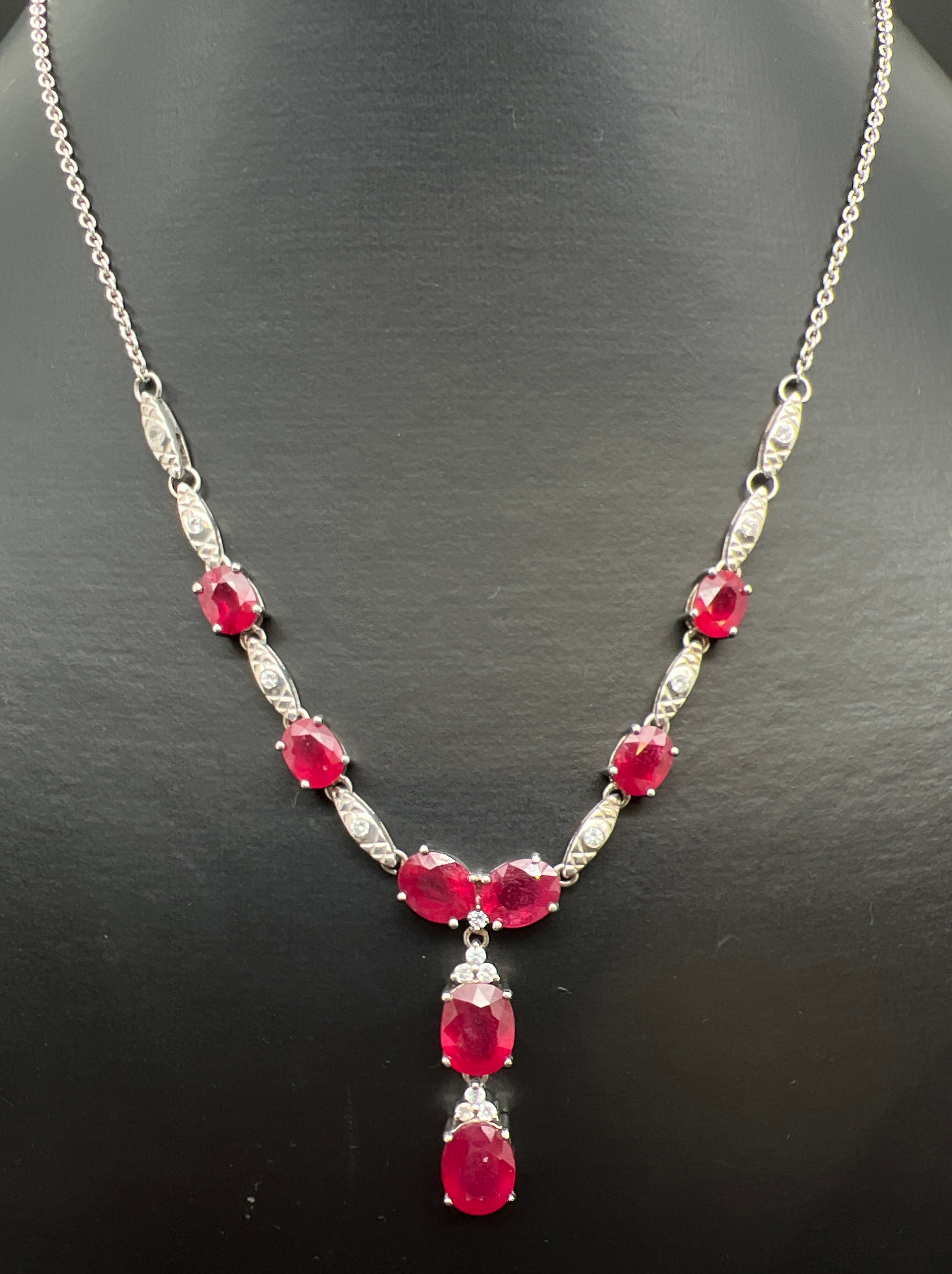 A silver ruby and white topaz fixed drop pendant necklace with spring ring clasp, by The Genuine Gem