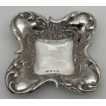 A late Victorian silver square shaped pin dish with decorative scroll & pierced work rim. Fully