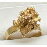 A bespoke made abstract gold nugget dress ring. No hallmarks to ring. Nugget tests as 18ct and