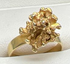 A bespoke made abstract gold nugget dress ring. No hallmarks to ring. Nugget tests as 18ct and