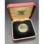 A boxed Royal Mint Dove of Peace 1995 £2 coin with coloured enamel detail to both front and back.