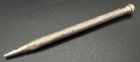 A vintage sterling silver propelling pencil with engine turned decoration to main body. Approx.