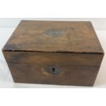 A vintage Wooden stationary/sewing box with filled cartouche and escutcheon. Approx. 25 x 17 cm.