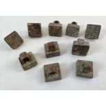 A collection of 10 assorted small metal Chinese seals. Each different to underside and approx. 2cm x