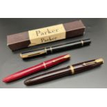 3 vintage fountain pens. A maroon Parker Lady pen, a black Parker Duofold with 14ct gold nib and a